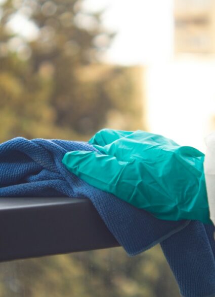 blue textile on brown wooden bench